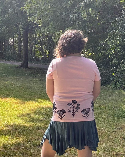 Free & Wild; pink short sleeve t-shirt featuring roses and wildflowers