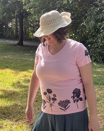 Free & Wild; pink short sleeve t-shirt featuring roses and wildflowers